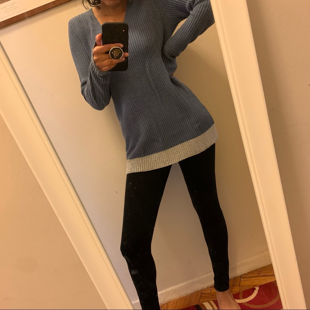 Long v neck knit sweater with decorative hem
